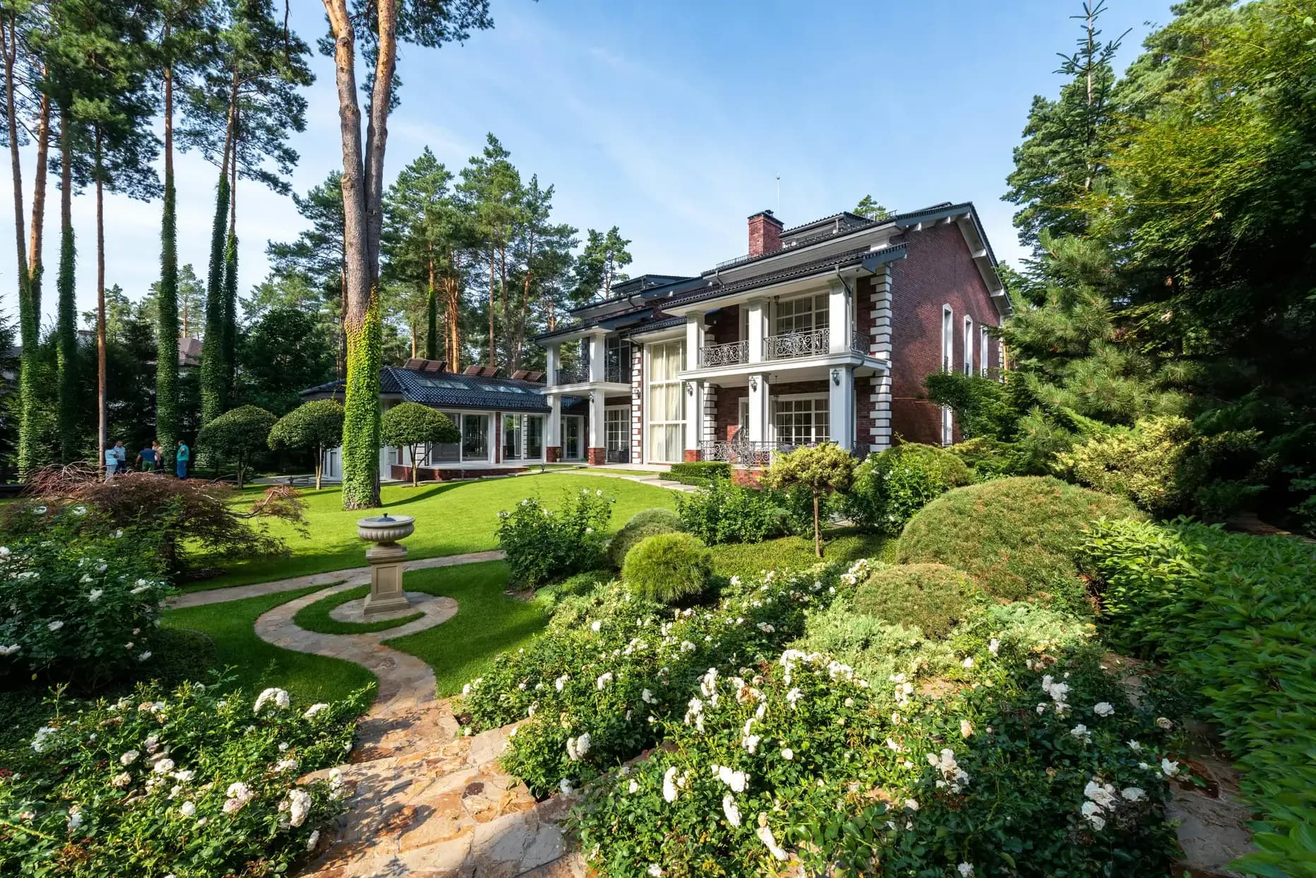 Atlanta Estate with Manicured Gardens Traditional Atlanta estate exterior with professionally manicured gardens and landscaping